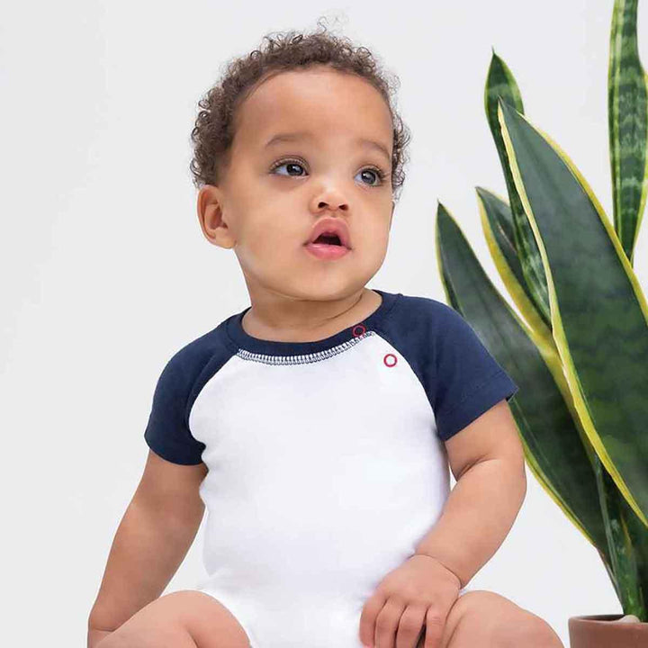 Little Tots Toys Organic Baby Baseball Playsuit in Navy being Worn Picture