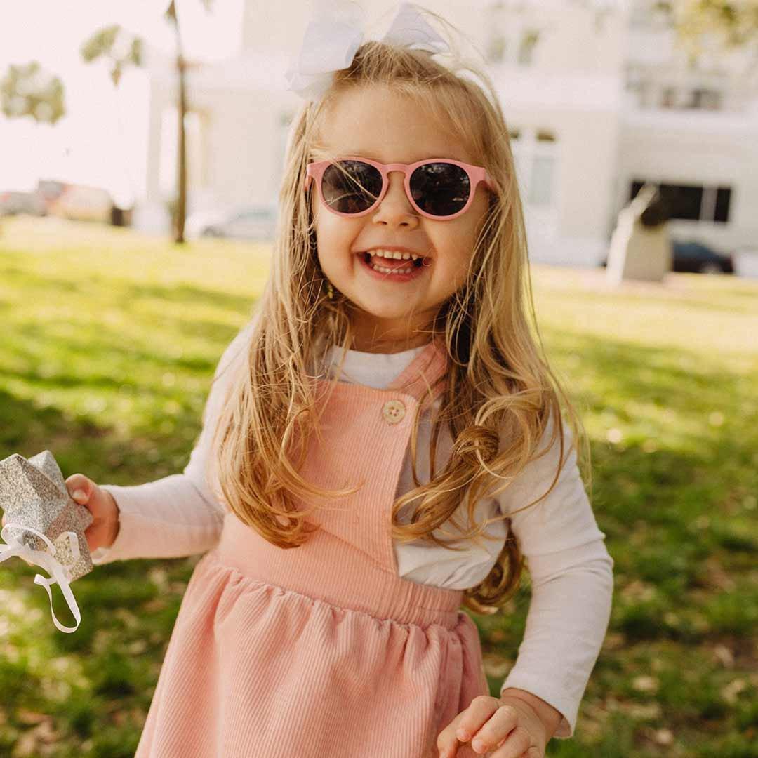 Babiators original keyhole sunglasses in pretty in pink being worn