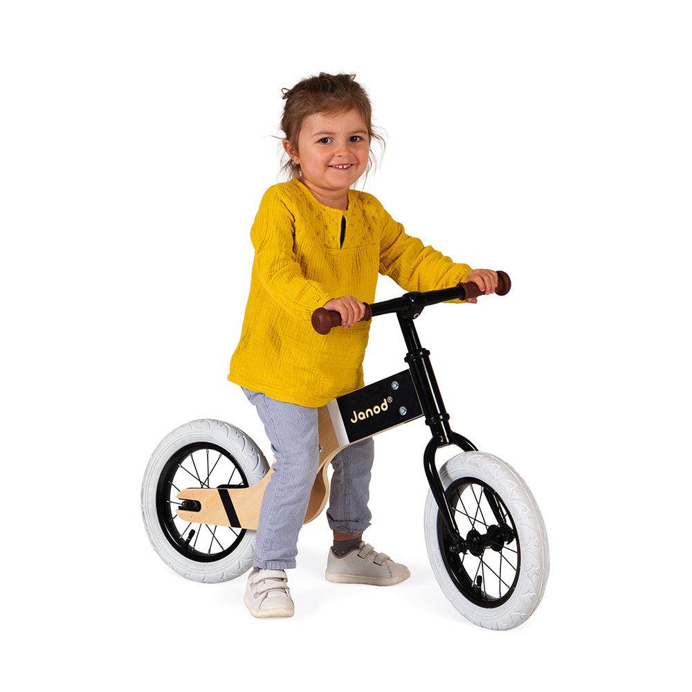 Janod Deluxe Balance Bike Being Ridden GIrl Picture