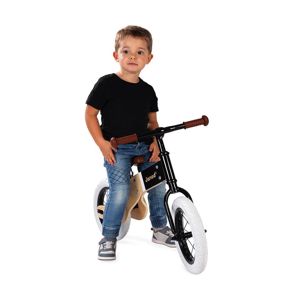 Janod Deluxe Balance Bike Being Ridden Boy Picture