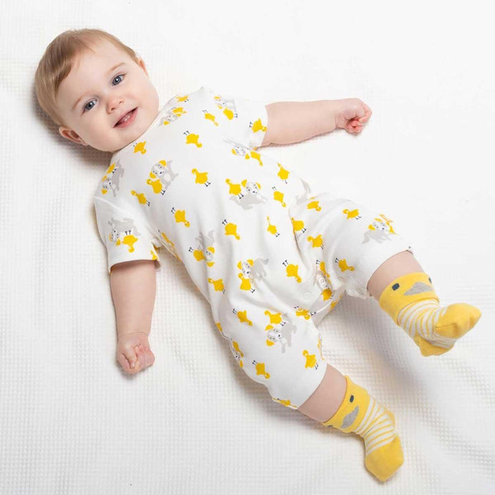 Kite eco-friendly GOTS certified organic cotton pup and duck romper being worn