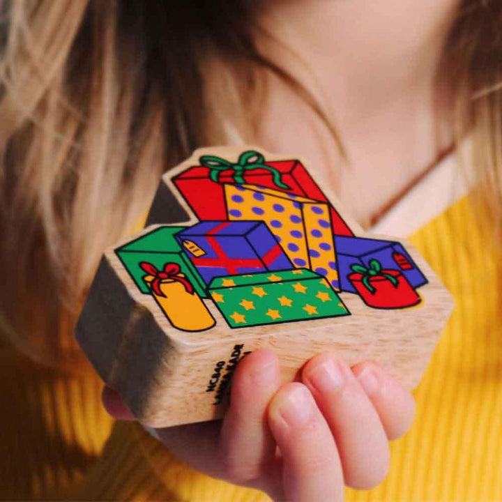 Lanka Kade Natural Wooden Colourful Stack of Presents Christmas Figure Being Held Picture