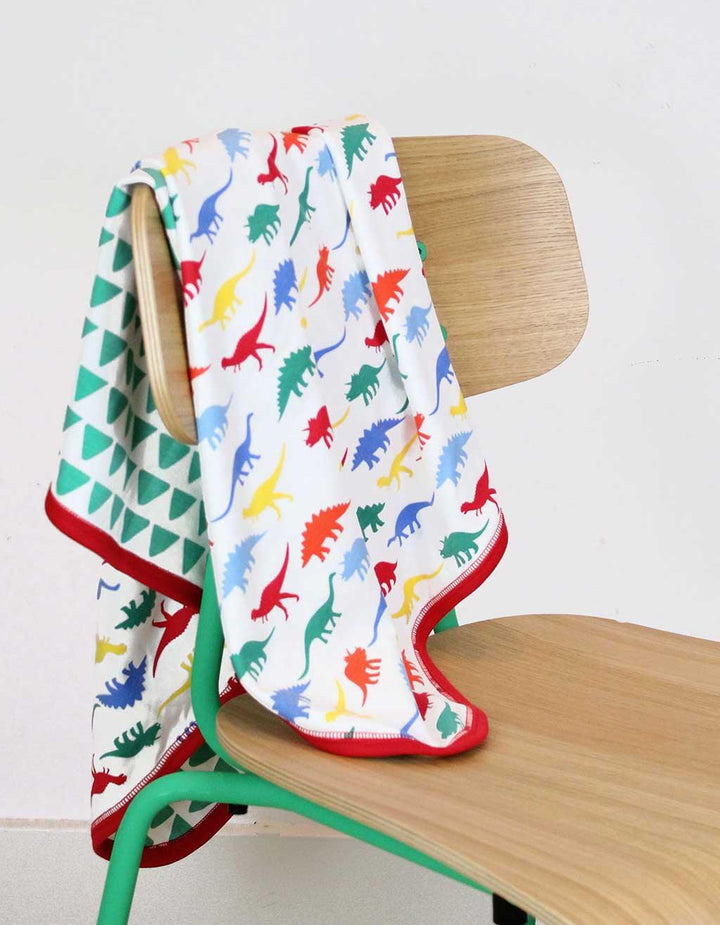 Toby Tiger GOTS Organic Cotton Multi Dino Blanket Hung Over Chair Picture